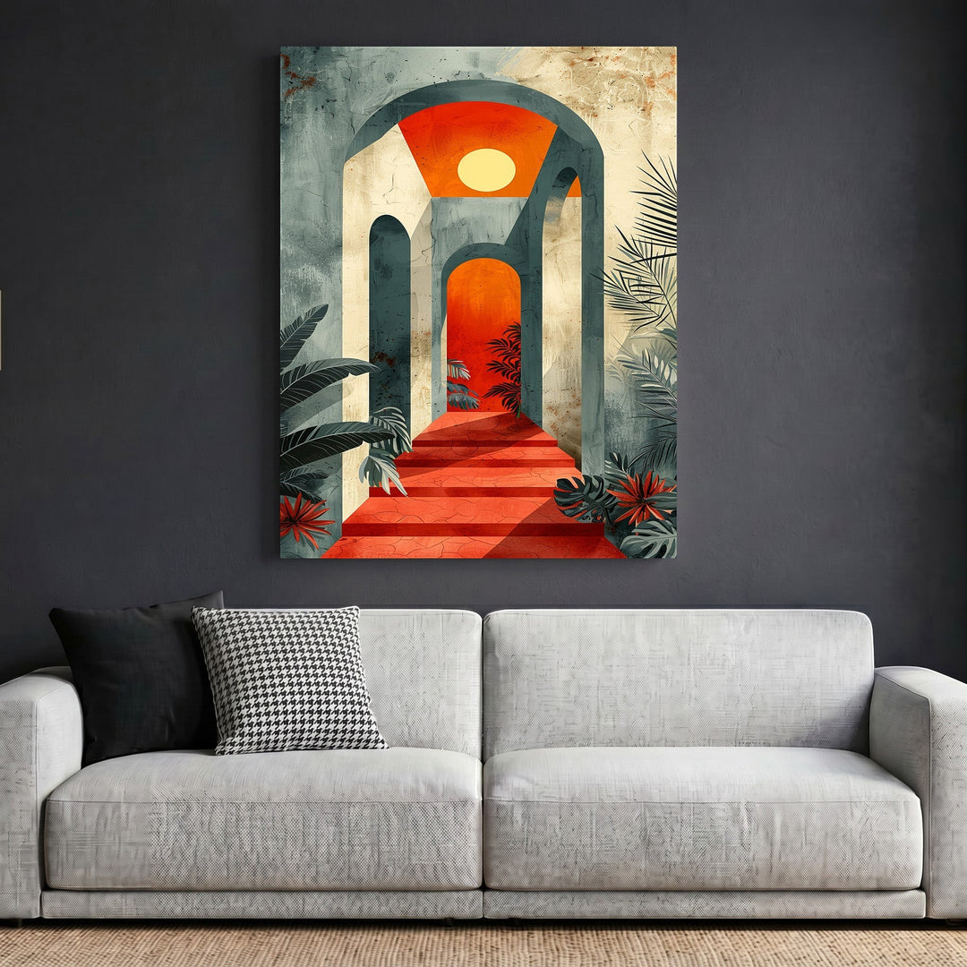 Wadi Home abstract architectural archway wall art featuring stone arches, vibrant red sunset, and lush foliage above a sofa.