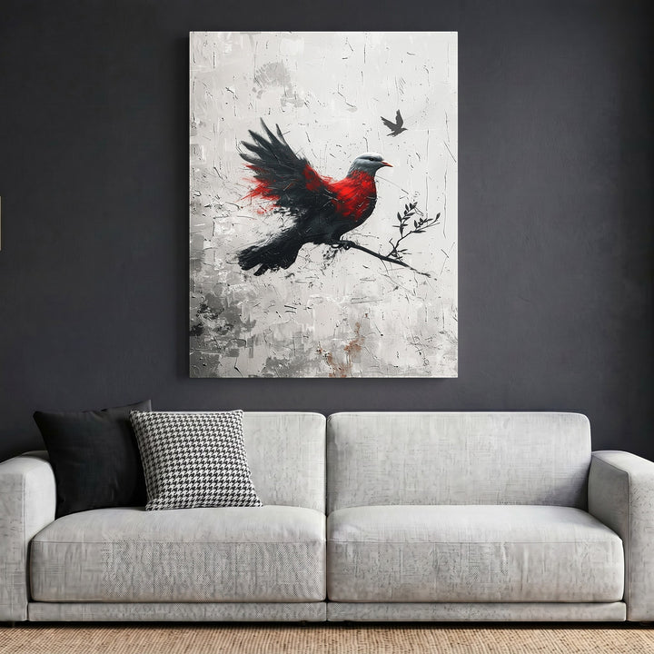 Wadi Home abstract bird canvas print with red and black brushstrokes on a textured white background above a sofa.