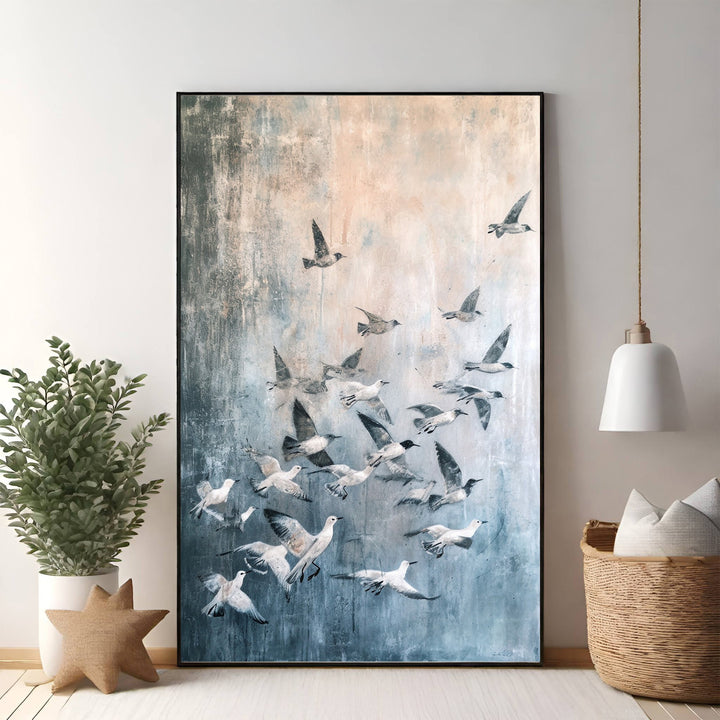 Wadi Home abstract wall art of a flock of birds in flight, textured blue and peach background.