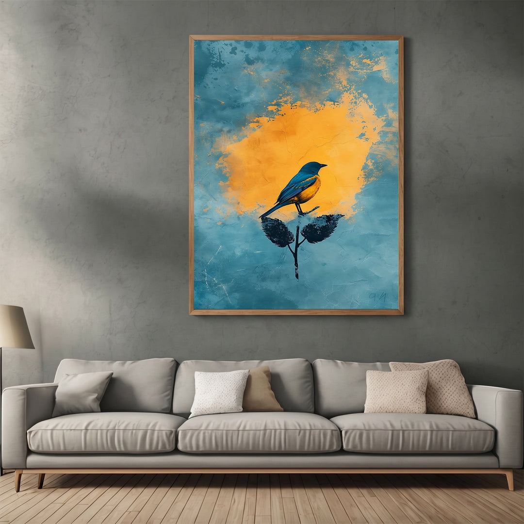 Wadi Home abstract bird wall art print with blue and yellow tones hanging above a modern grey sofa in a living room.