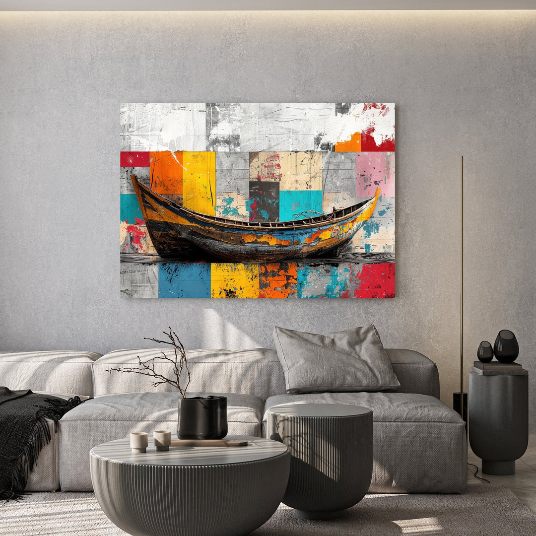 Wadi Home abstract boat canvas print with vibrant geometric background hanging above a modern grey sofa.