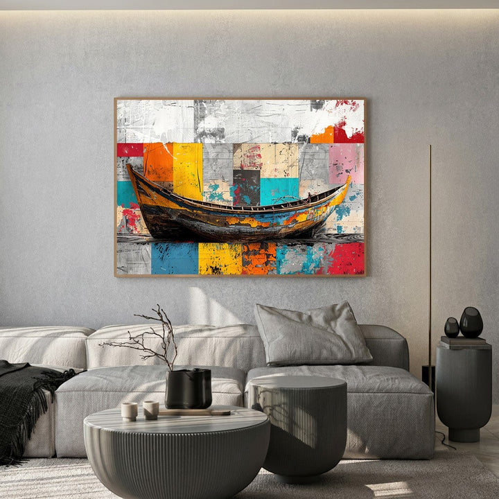 Wadi Home abstract boat canvas print with vibrant geometric background hanging above a modern grey sofa in a living room.