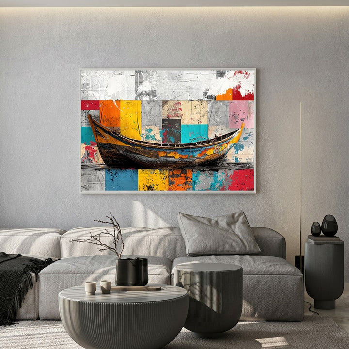 Wadi Home abstract boat canvas print with vibrant geometric background hanging above a modern grey sofa in a living room