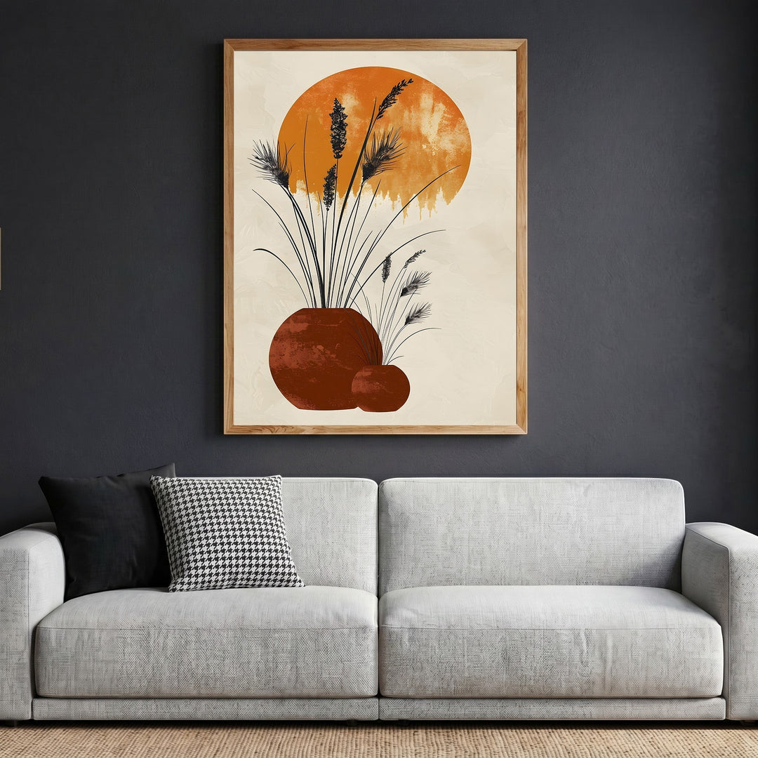 Wadi Home abstract botanical framed wall art featuring terracotta vessels and grasses on a neutral background above a sofa.