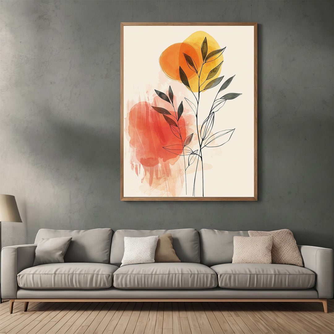 Wadi Home framed abstract botanical line art with orange and yellow watercolor accents hanging above a grey sofa.