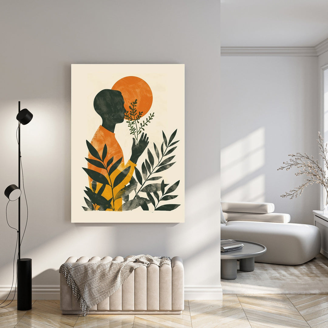 Wadi Home abstract wall art featuring a dark silhouette of a person smelling a plant with an orange sun and green leaves.