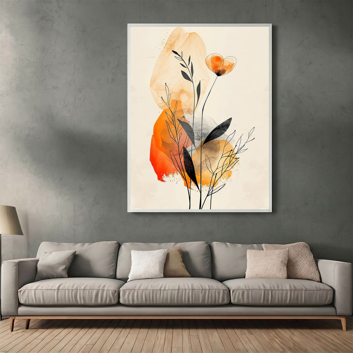 Wadi Home abstract botanical wall art print with amber and charcoal watercolor flora above a modern grey sofa.