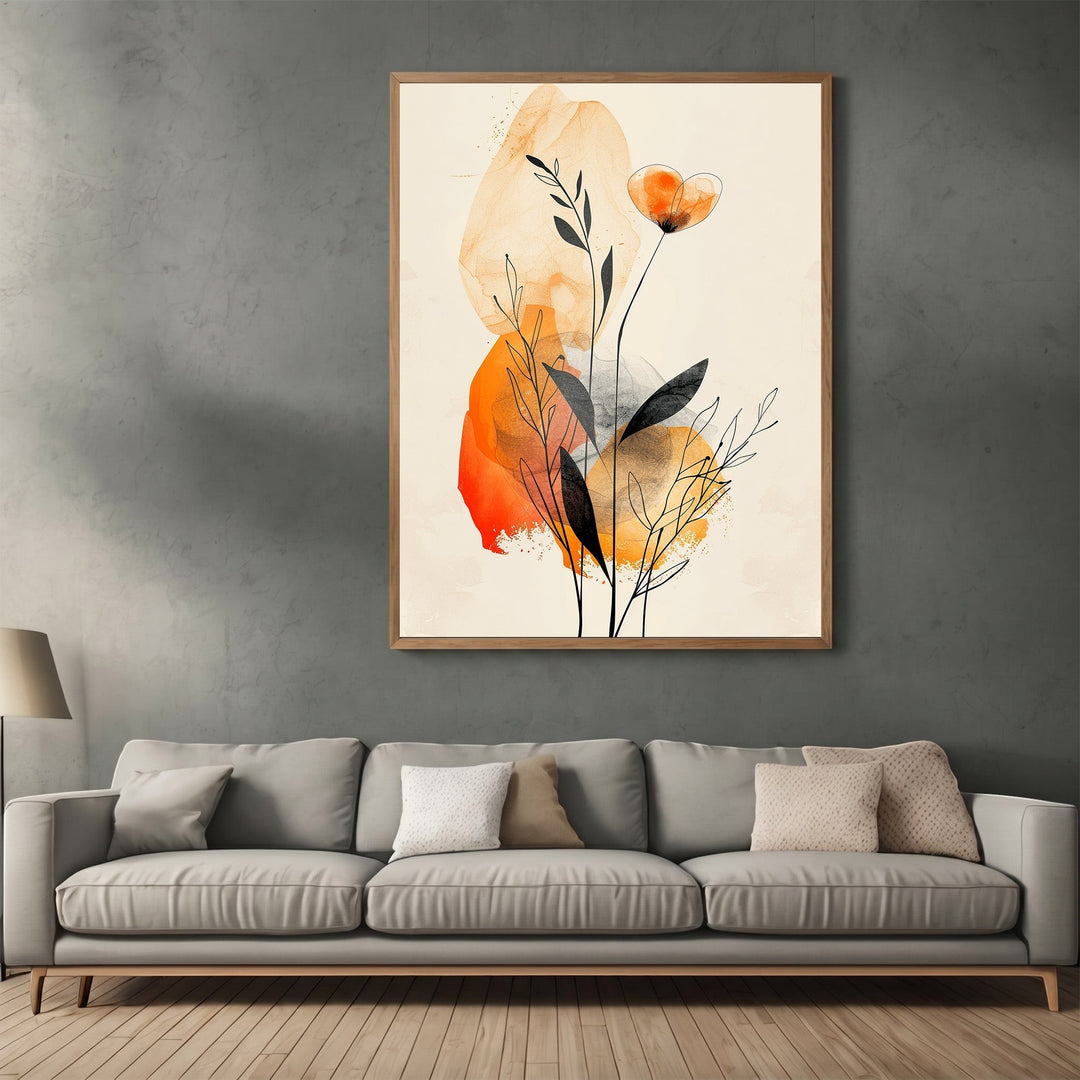 Wadi Home abstract botanical wall art print with amber and charcoal watercolor accents above a modern grey sofa.