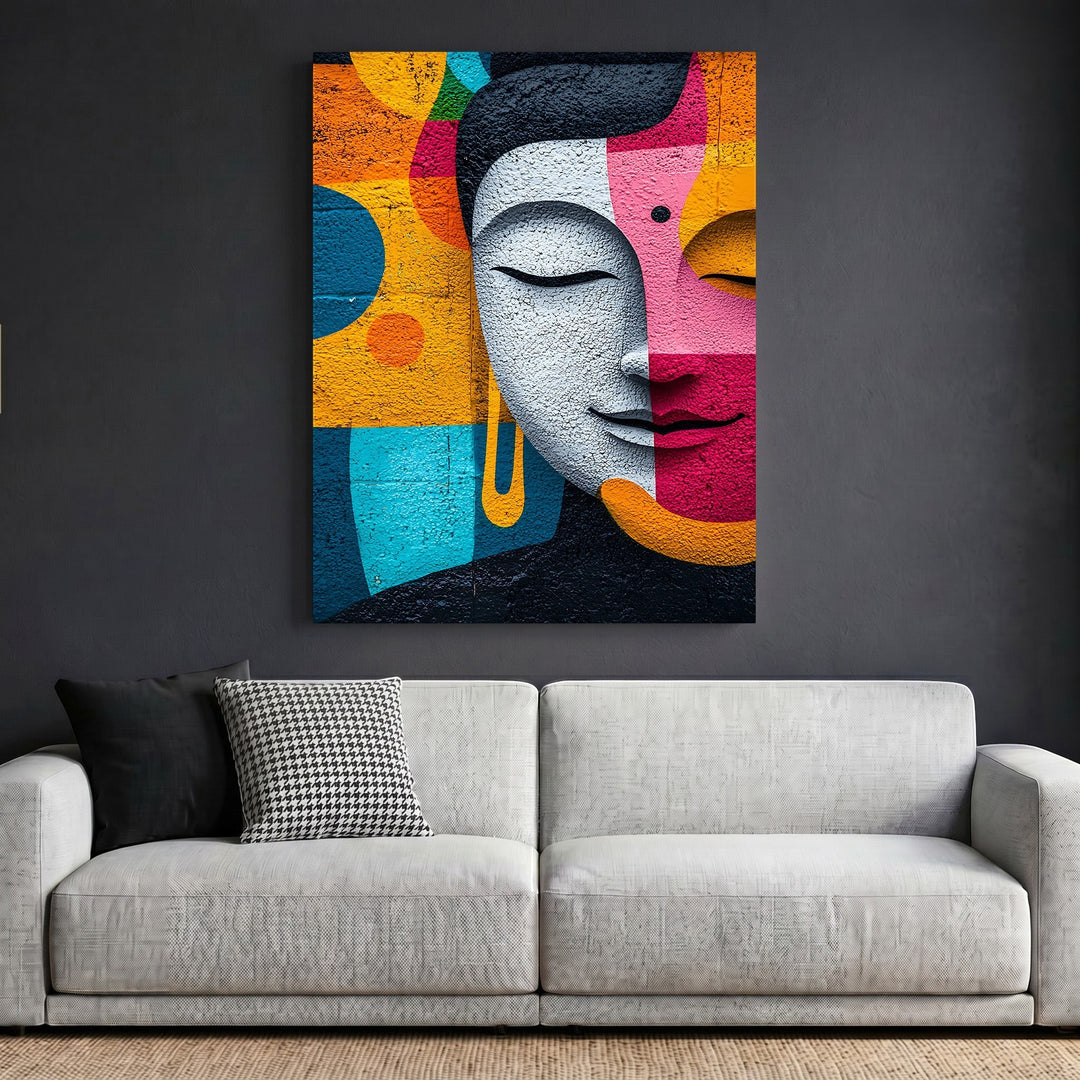 Wadi Home abstract Buddha face wall art print with vibrant orange, magenta, and teal geometric shapes above a sofa.