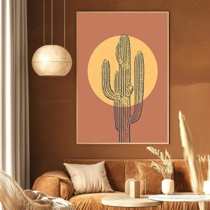Wadi Home abstract desert cactus wall art print with a golden sun in terracotta and charcoal tones above a sofa.