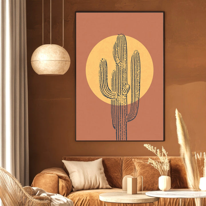 Wadi Home abstract cactus wall art print with a golden sun on a terracotta background, displayed in a modern living room.