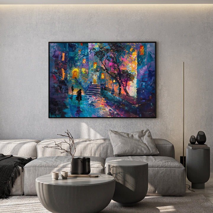 Wadi Home abstract cityscape canvas print with textured blue and purple brushstrokes hanging above a grey sofa.