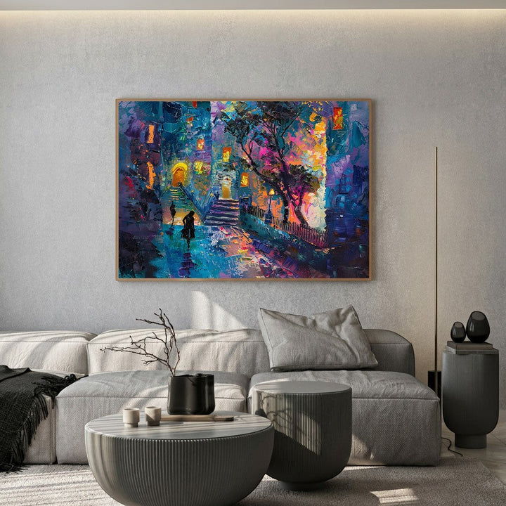 Wadi Home abstract cityscape canvas print with textured blue and purple impasto brushstrokes hanging above a grey sofa.