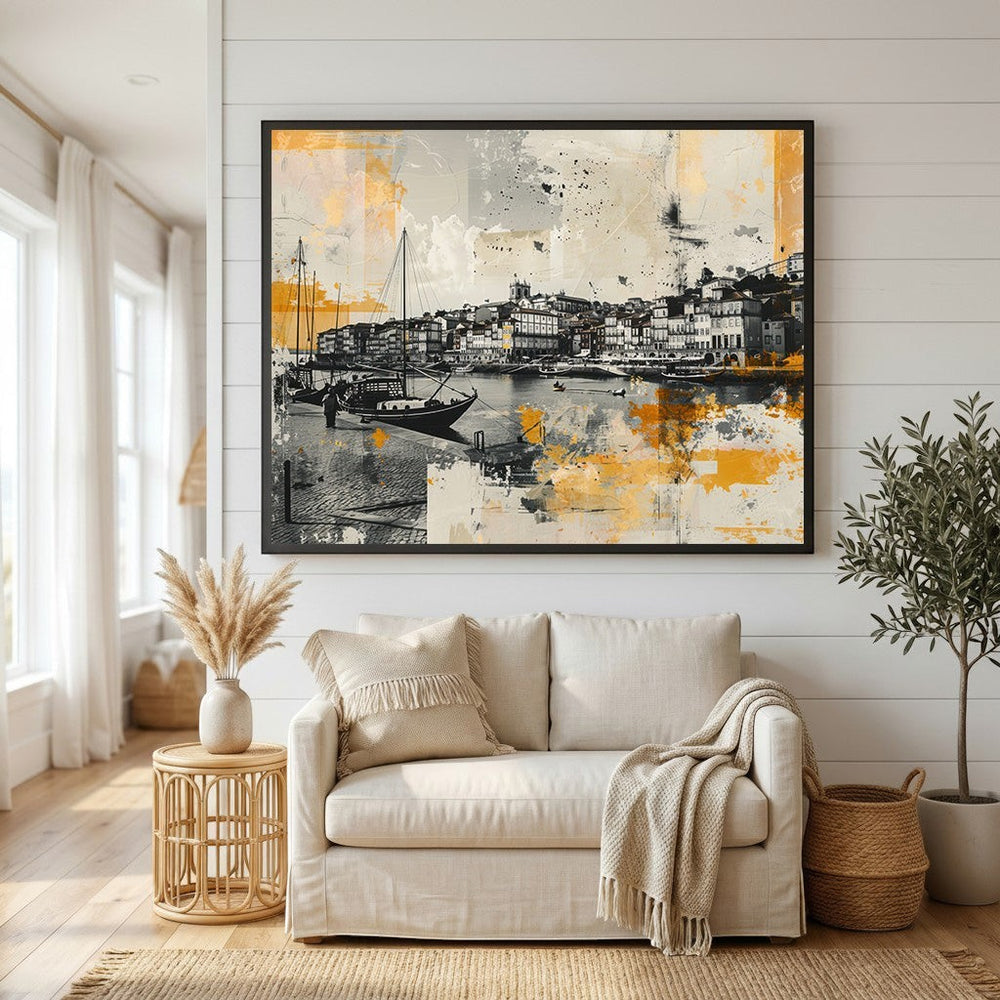 Wadi Home abstract coastal harbor wall art print in black, white, and golden yellow hanging above a beige sofa.