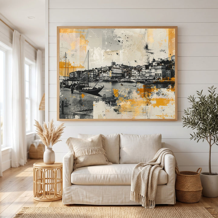 Wadi Home abstract coastal harbor wall art print in black, white, and yellow, framed above a beige living room sofa.