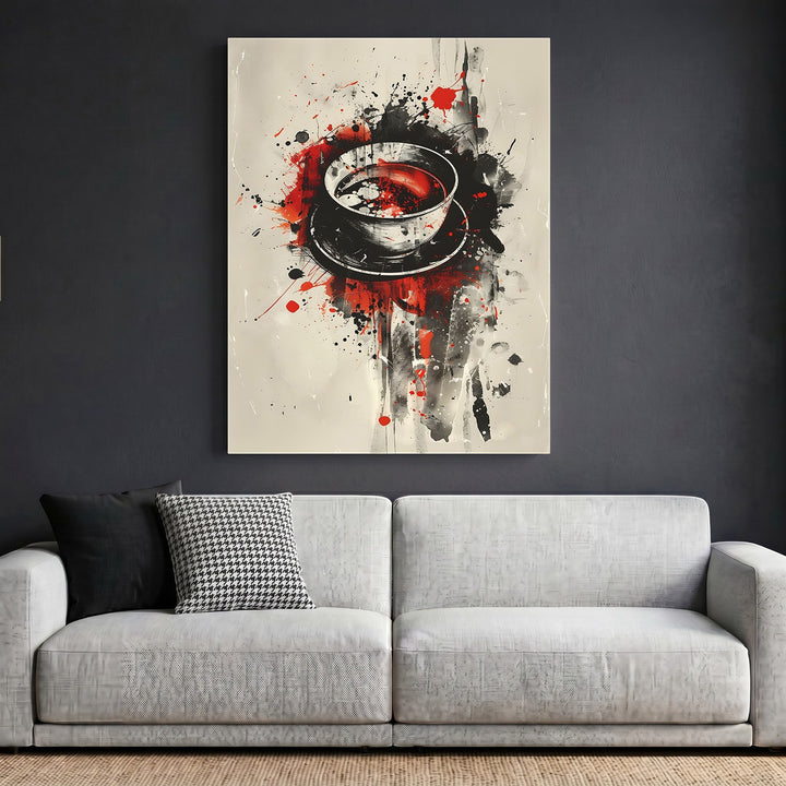 Wadi Home abstract coffee cup framed wall art print with black, red, and cream splatter paint design above a sofa.