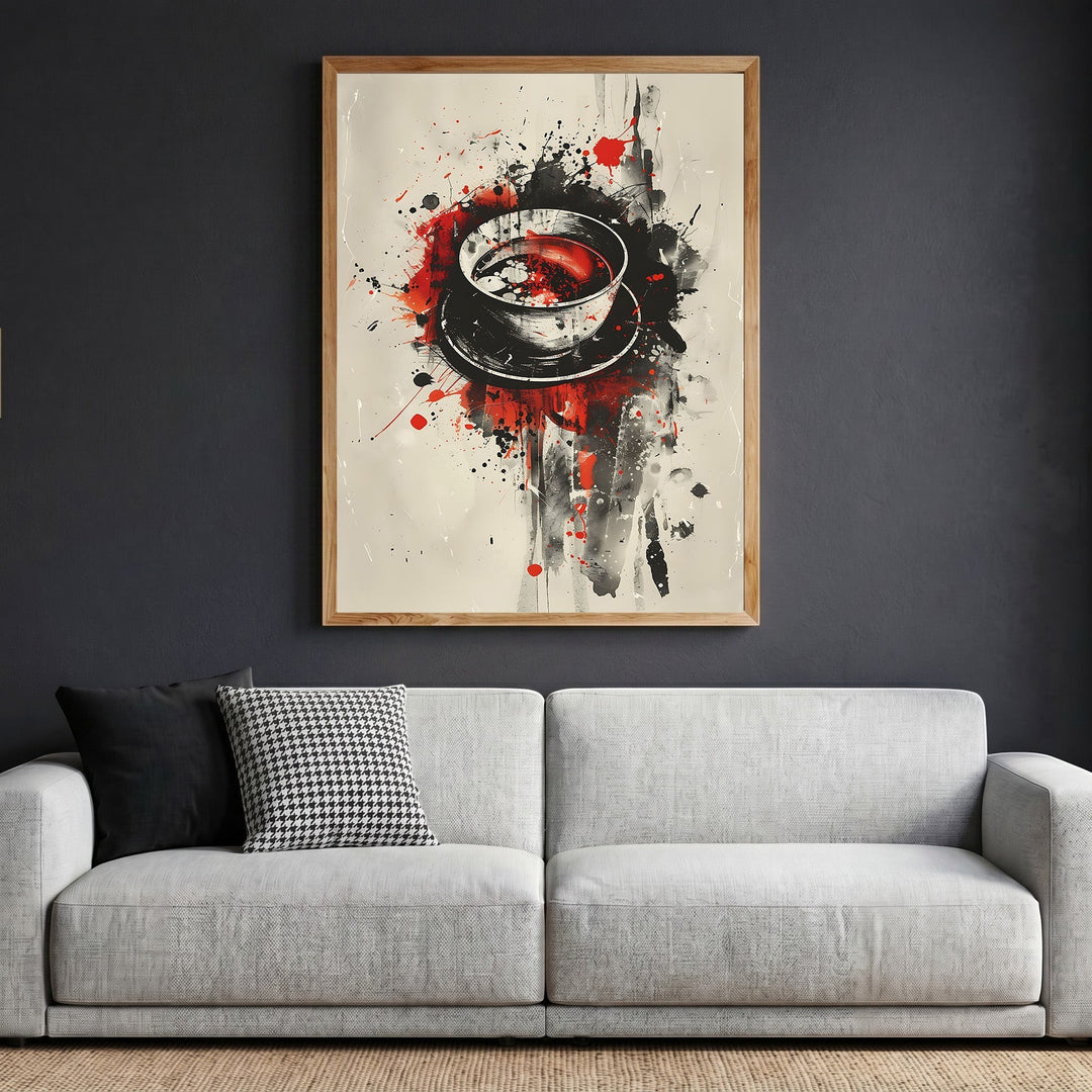 Wadi Home abstract coffee cup wall art print with black, red, and cream splatter paint in a wooden frame above a sofa.