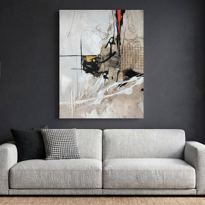 Wadi Home abstract expressionist framed wall art with neutral tones, black, gold, and red accents above a modern sofa.