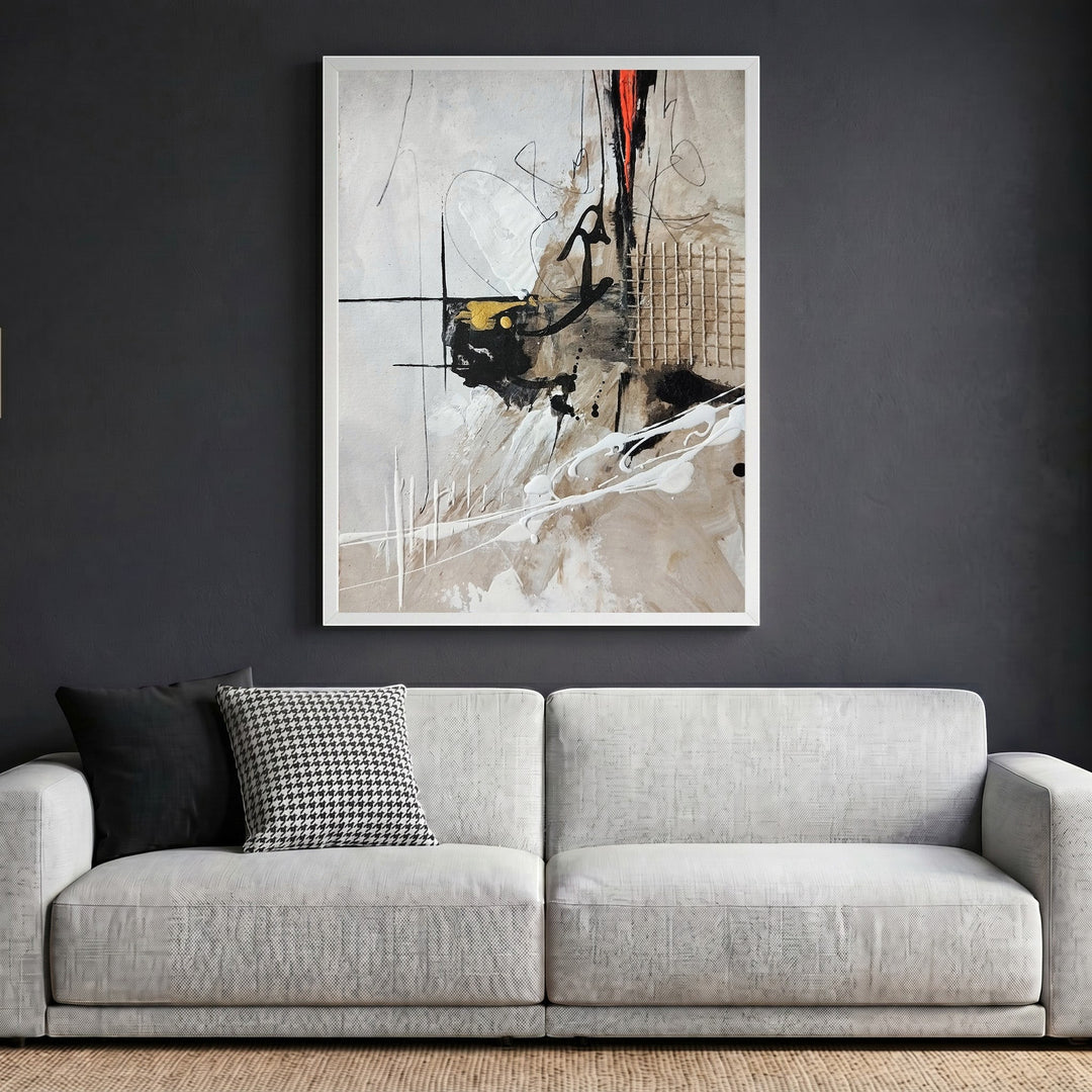 Wadi Home abstract expressionist framed wall art with neutral tones, black, gold, and red accents above a modern sofa.
