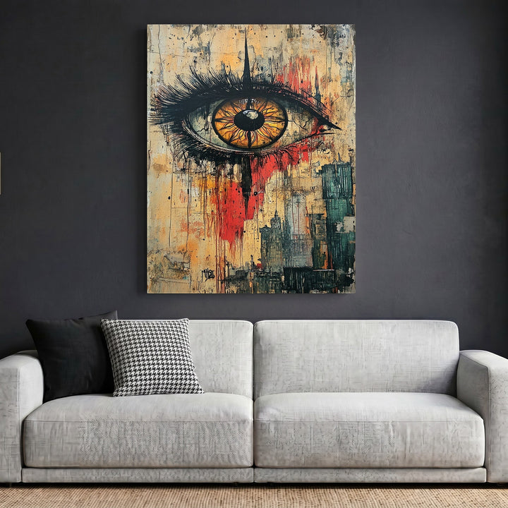Wadi Home abstract eye wall art print with earthy tones, red accents, and charcoal details above a modern sofa.