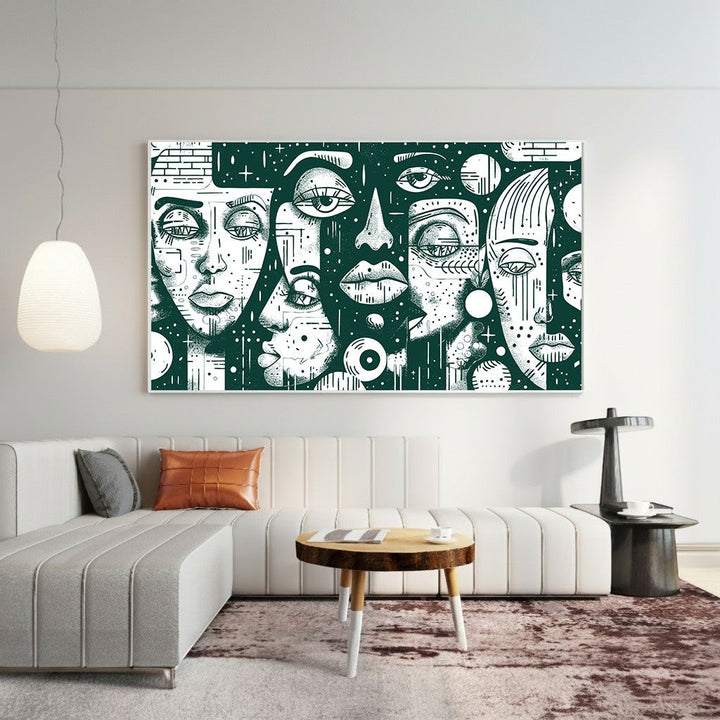 Wadi Home framed abstract face wall art with dark green and white graphic illustration hanging above a modern sofa.