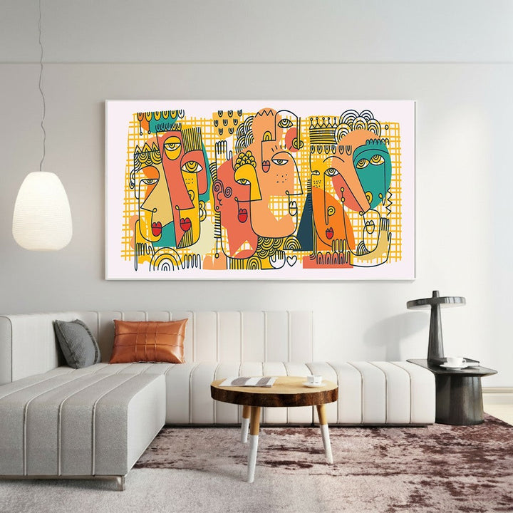 Wadi Home abstract faces canvas wall art featuring teal, orange, and yellow geometric designs above a modern sofa.
