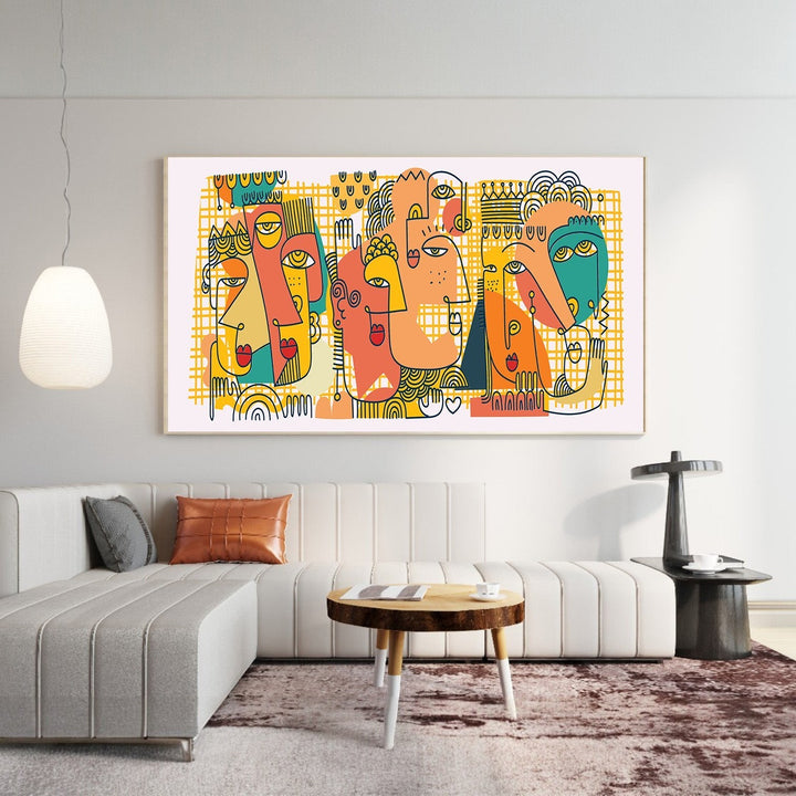 Wadi Home abstract faces canvas print with teal, orange, and yellow geometric art hanging above a modern sofa.