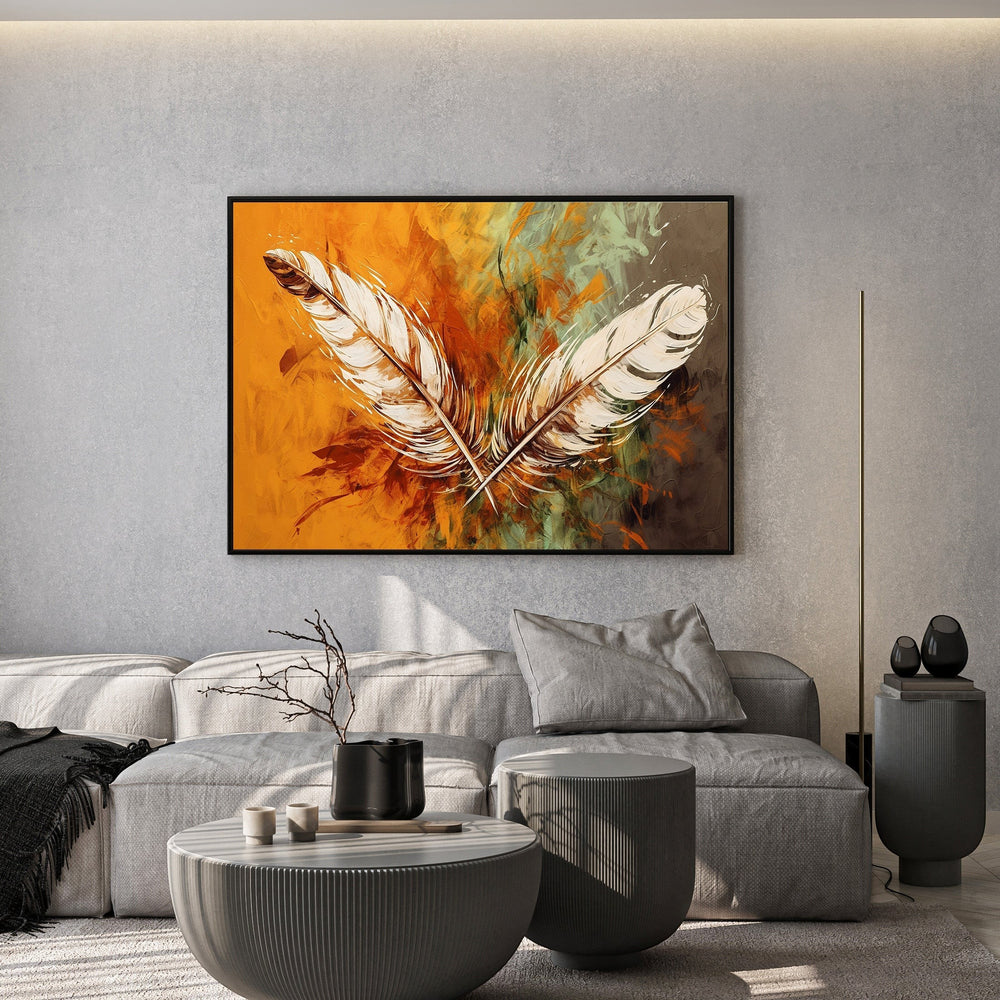 Wadi Home abstract feather wall art canvas print with ochre and orange tones hanging above a modern grey sofa.