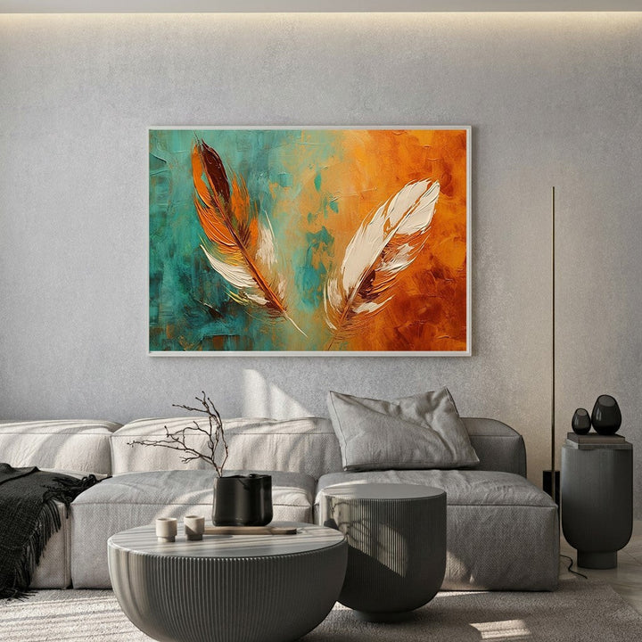 Wadi Home abstract feather canvas painting with teal and orange textured brushwork hanging above a modern grey sofa.