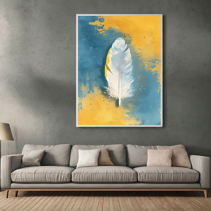 Wadi Home abstract feather canvas print with white feather on textured blue and yellow background in a living room.