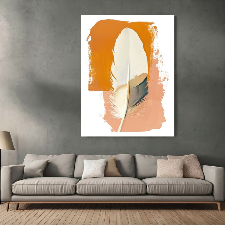 Wadi Home abstract feather wall art print with burnt orange and terracotta brushstrokes above a modern grey sofa.
