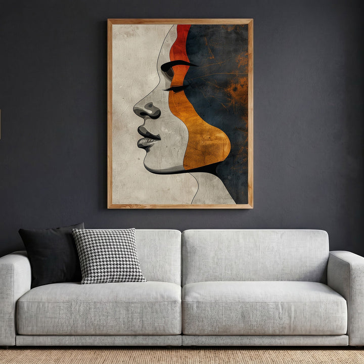 Wadi Home abstract female profile wall art print with terracotta, charcoal, and ochre tones in a wooden frame.