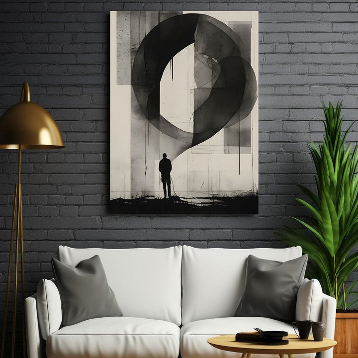 Wadi Home abstract monochromatic wall art featuring a solitary figure silhouetted against a large, dark, abstract shape.