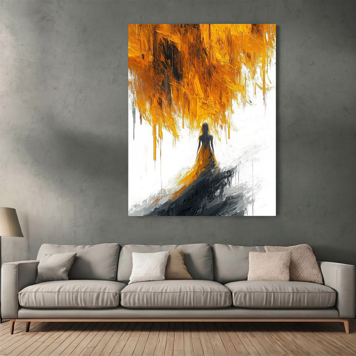 Wadi Home abstract figure wall art print with ochre and charcoal brushstrokes hanging above a modern grey sofa.