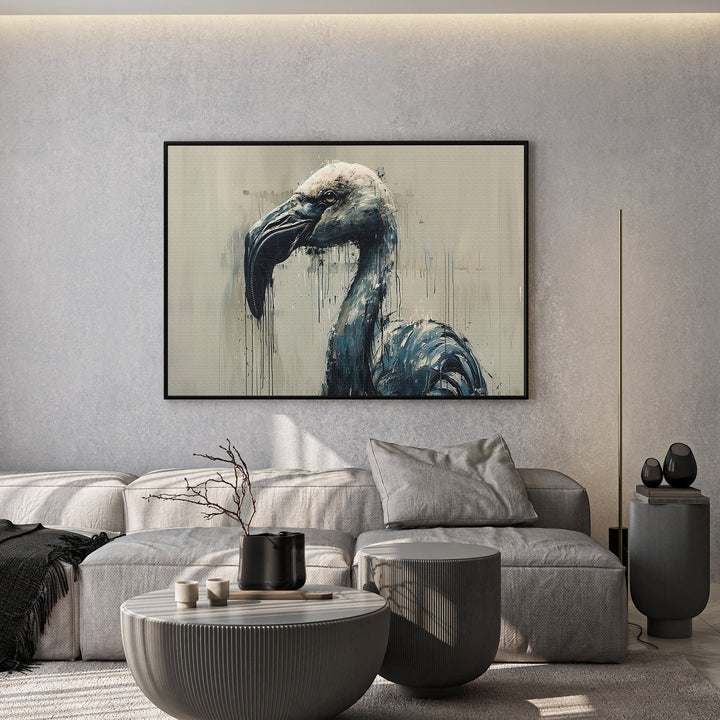 Wadi Home abstract flamingo wall art print in moody blue and charcoal tones displayed above a modern grey sofa.