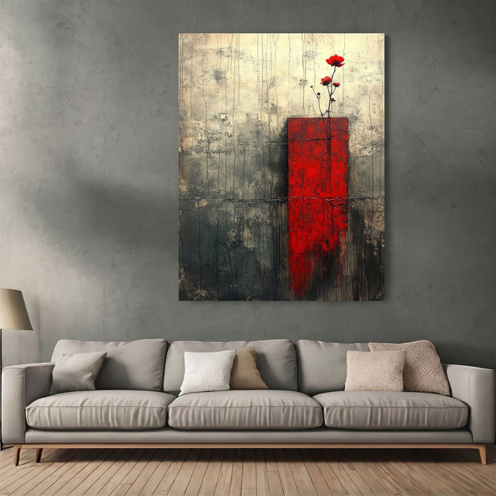 Wadi Home abstract floral canvas print with red and charcoal textured design hanging above a modern grey sofa