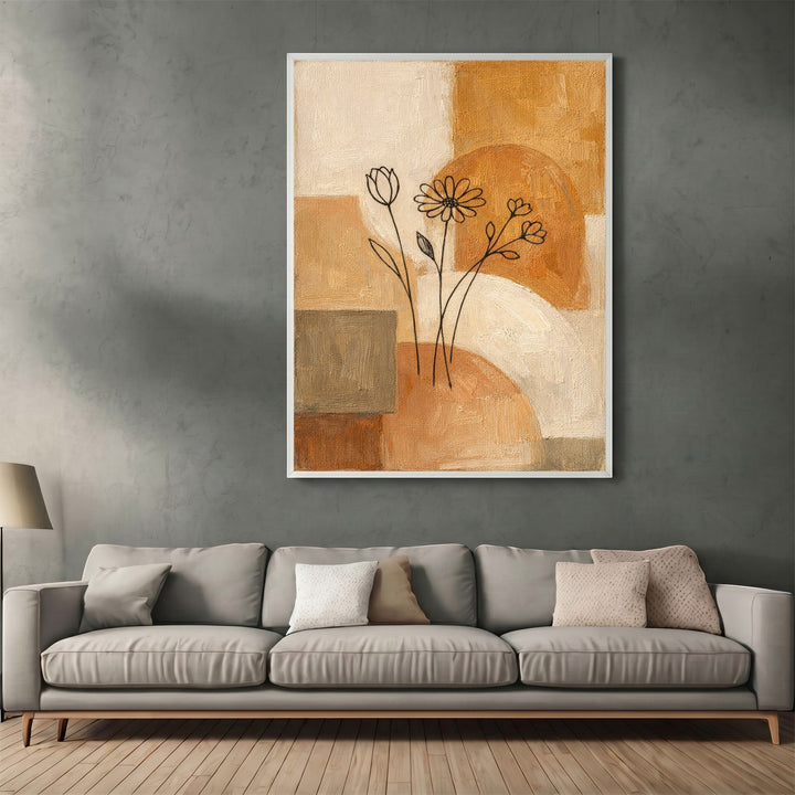 Wadi Home abstract floral canvas print with ochre, cream, and terracotta geometric shapes above a modern sofa.