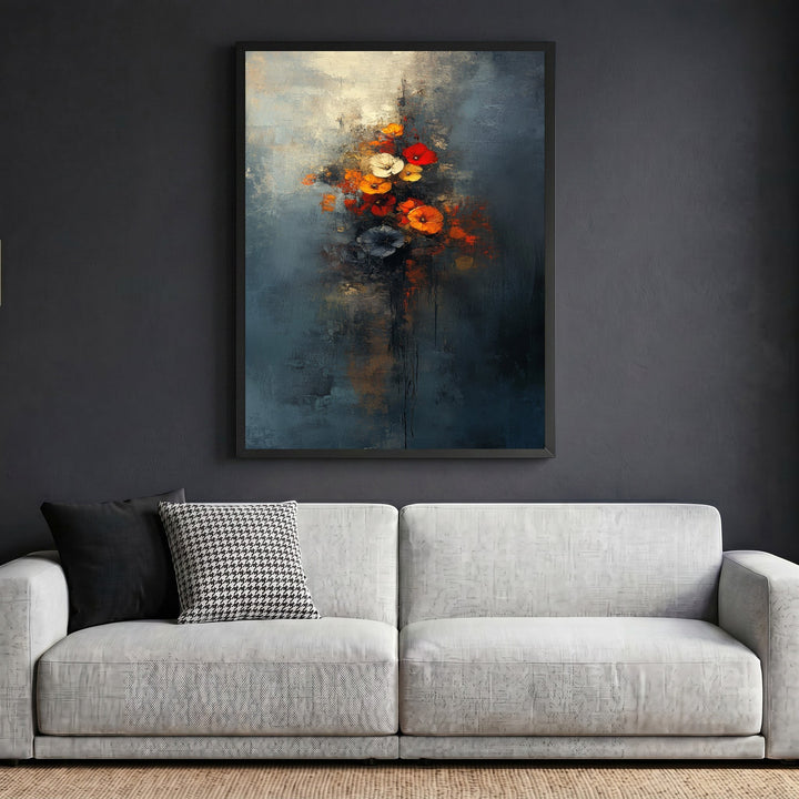 Wadi Home abstract floral bouquet framed wall art with moody blue tones and vibrant red flowers above a modern sofa.
