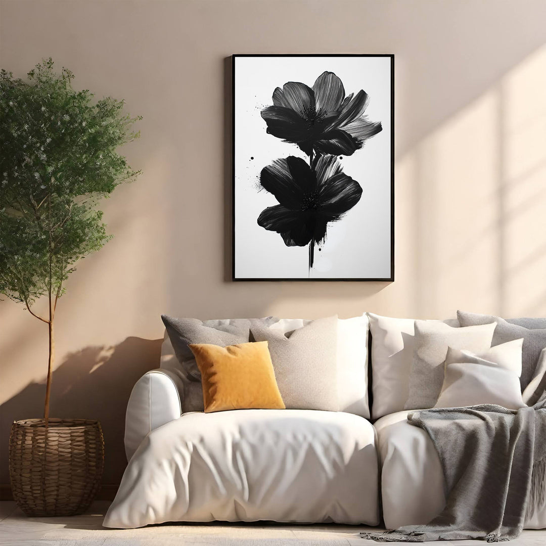 Wadi Home abstract black floral wall art with bold brushstrokes on white background, framed.