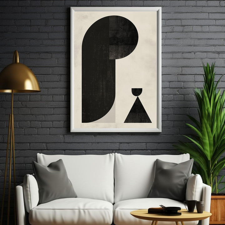Wadi Home abstract geometric art print with black shapes on a neutral textured background, framed in white.