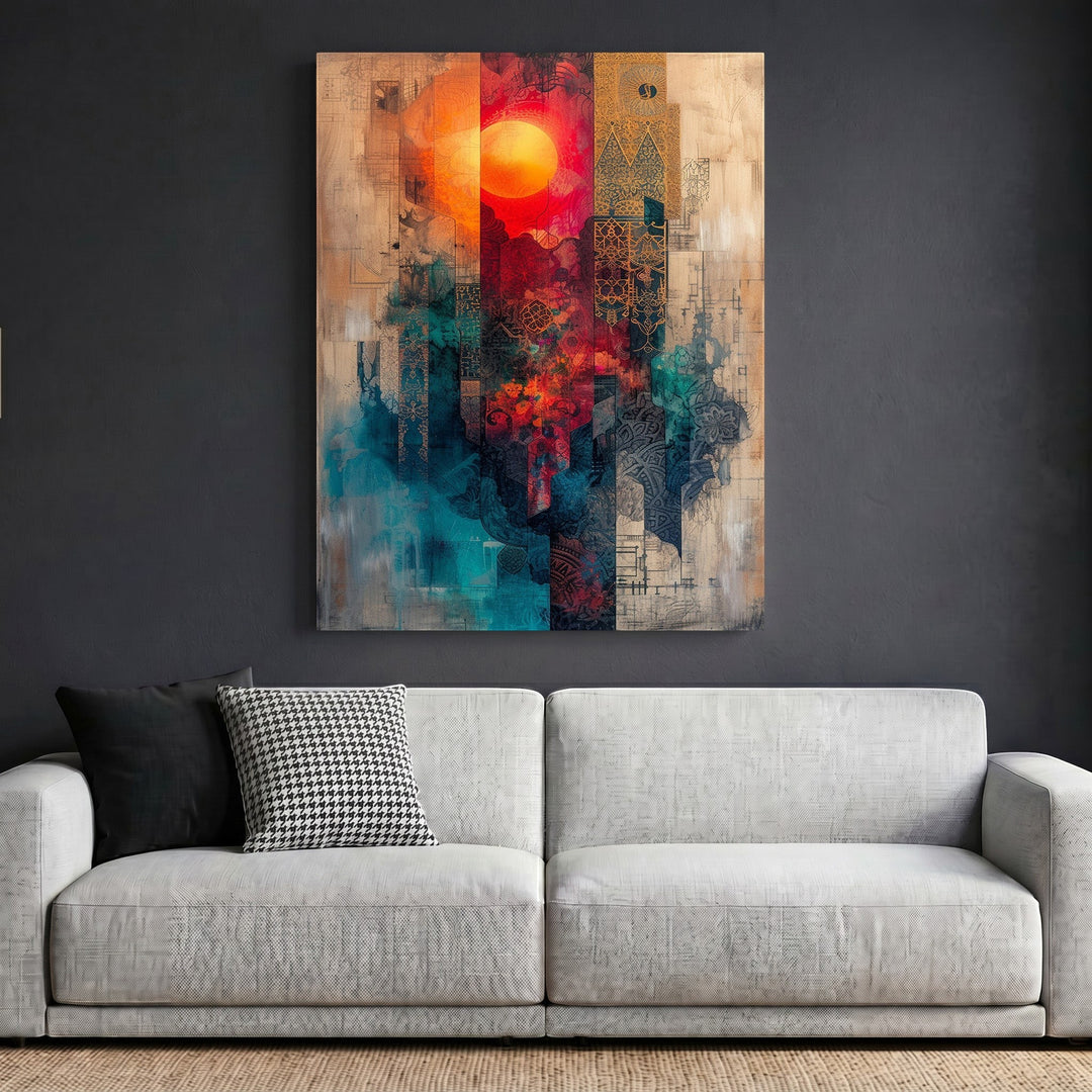 Wadi Home abstract geometric canvas wall art featuring a vibrant sun motif in red, teal, and earth tones above a sofa.