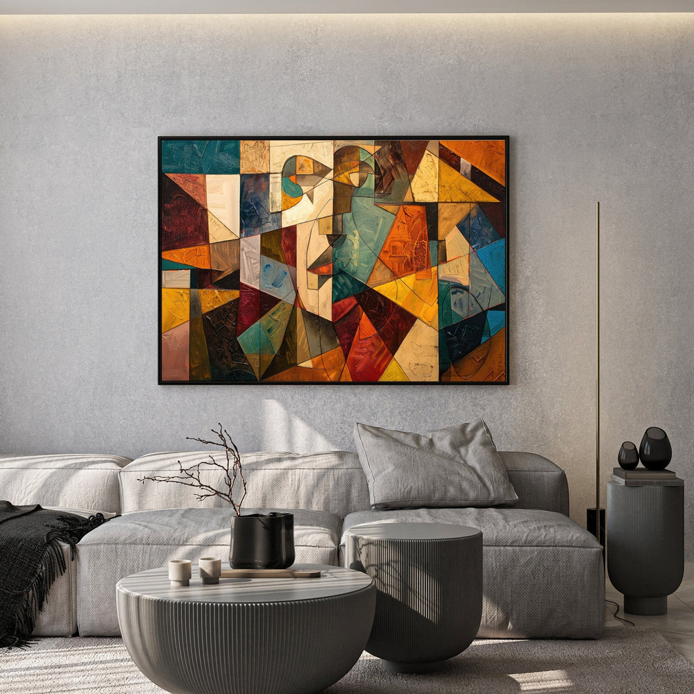 Wadi Home abstract geometric canvas print with ochre, teal, and orange tones hanging above a modern grey sofa.
