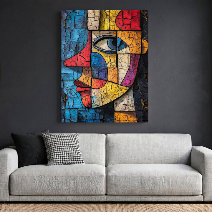 Wadi Home abstract geometric face wall art with cracked texture in vibrant colors hanging above a modern sofa