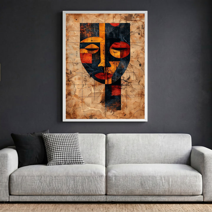 Wadi Home abstract geometric face wall art print with earthy tones and parchment texture hanging above a modern sofa.