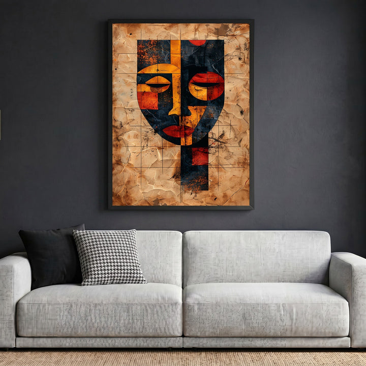 Wadi Home abstract geometric face wall art print in black frame hanging above a modern white sofa in a living room.