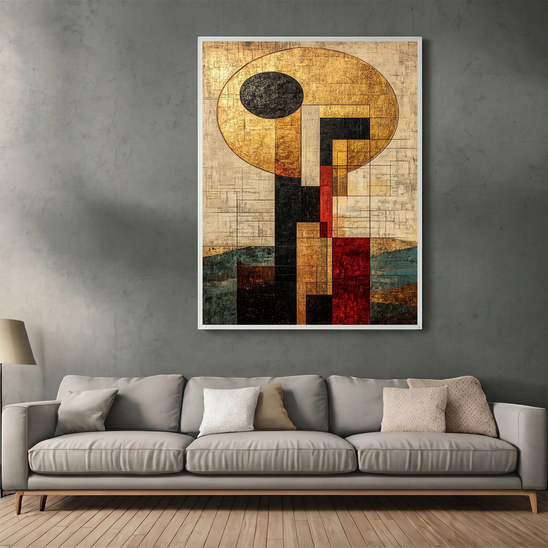 Wadi Home abstract geometric framed wall art with gold, black, and red accents hanging above a modern grey sofa.