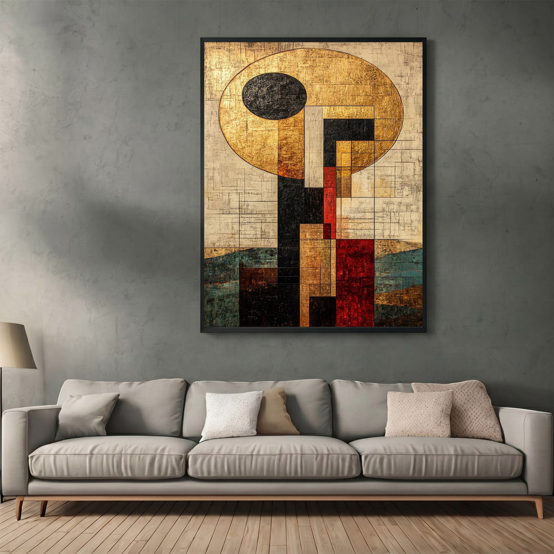 Wadi Home abstract geometric framed wall art with gold, black, and red accents hanging above a modern grey sofa.