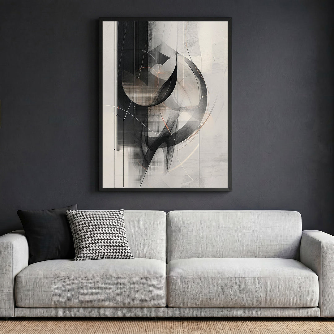 Wadi Home abstract geometric framed wall art in black and grey hanging above a modern white sofa.
