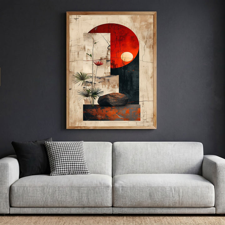 Wadi Home abstract geometric framed wall art with a red sun motif and botanical accents above a modern grey sofa.