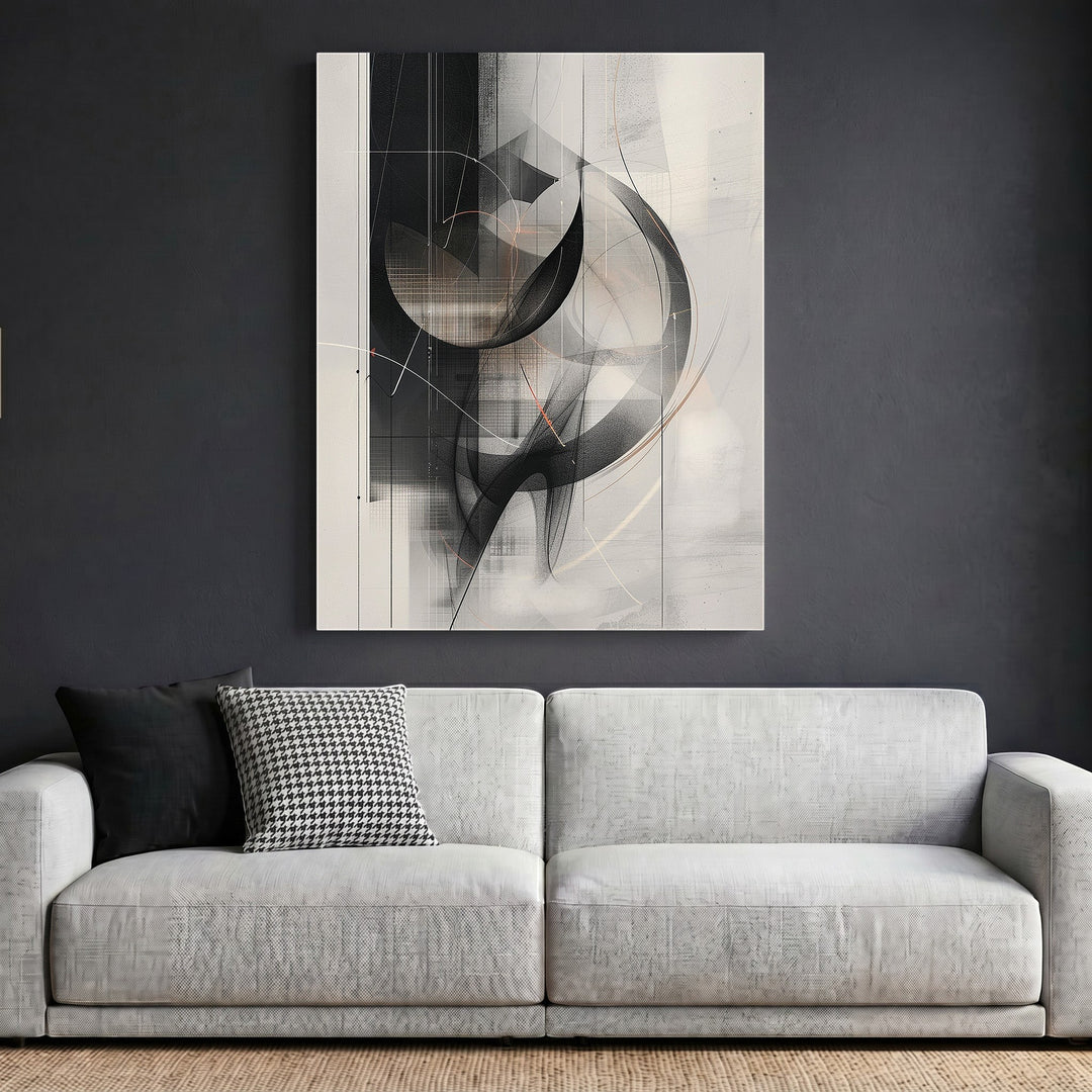 Wadi Home abstract geometric framed wall art in black and grey hanging above a modern light grey sofa.